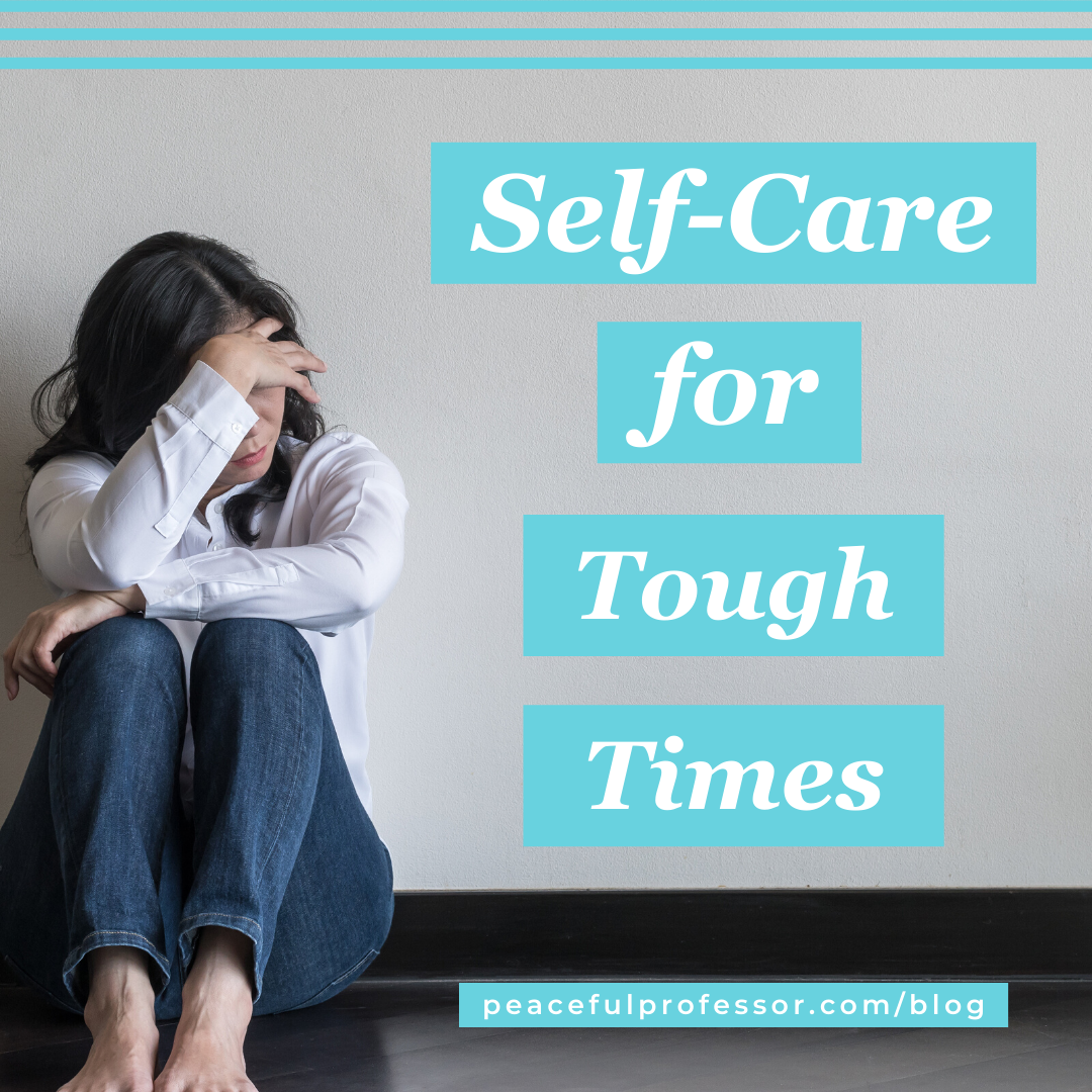 Young woman sitting against a wall with her head in her hands. Self-care for tough times.